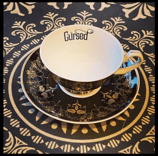 Quirks! tea cup Black Nouveau Cursed Insult Teacup and Saucer by Miss Havisham